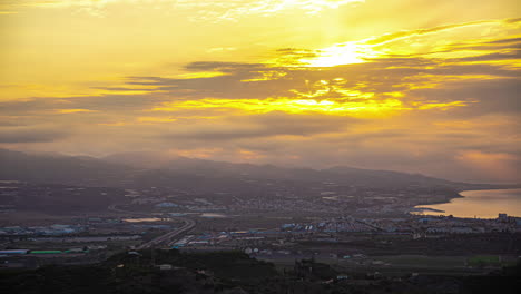 dramatic sunrise timelapse over malaga with rolling clouds