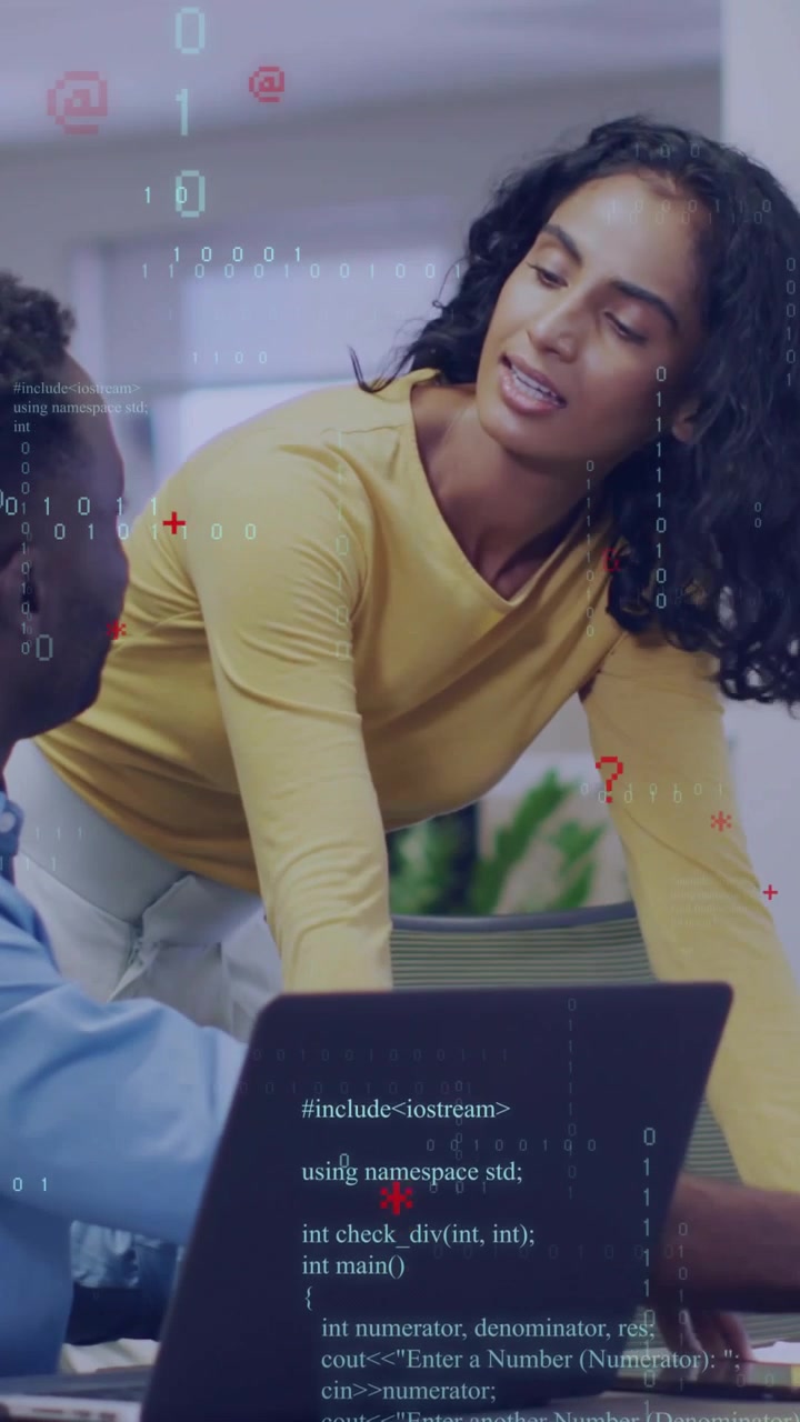 Vertical video: Woman leaning pointing at laptop guiding man while code overlay syncing debugging