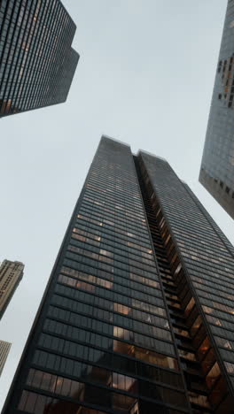 looking up at skyscrapers in a city