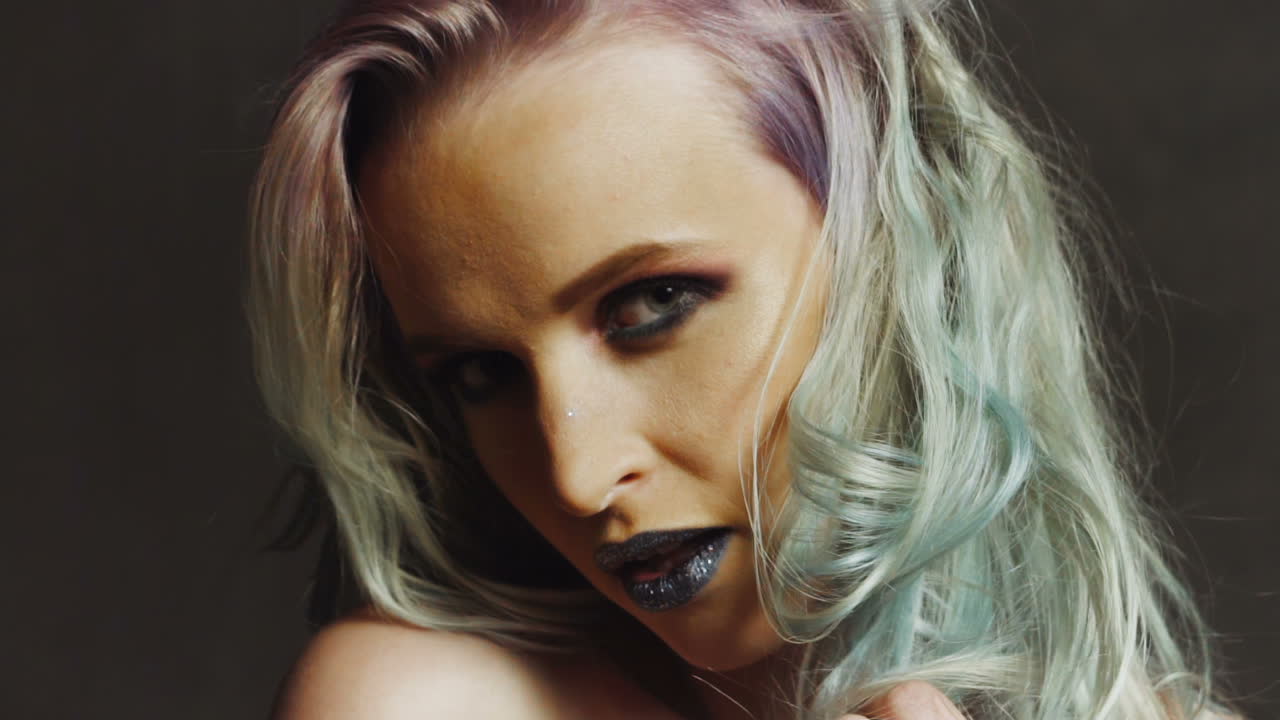 Beauty Portrait. Hairstyle. Portrait of a beautiful girl with colored hair, professional hair coloring