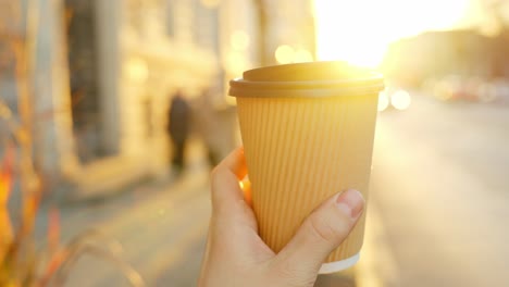 recyclable paper cup for beverage on a sunny morning in helsinki