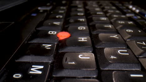 macro slow travel over an empty laptop keyboard in a dark room