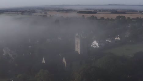 Drone-Shot-Orbiting-Islip-Church-In-Mist-08