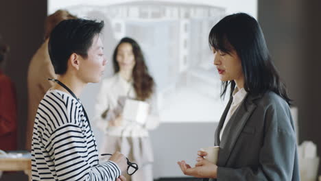 asian women speaking on business event