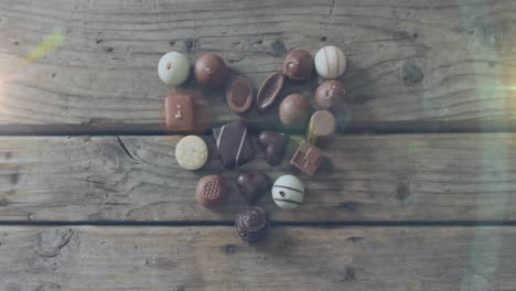 animation of light spots over chocolate on wooden table