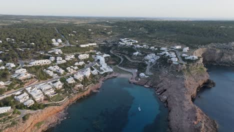 panoramic aerial overview of cala morell peaceful village by the sea