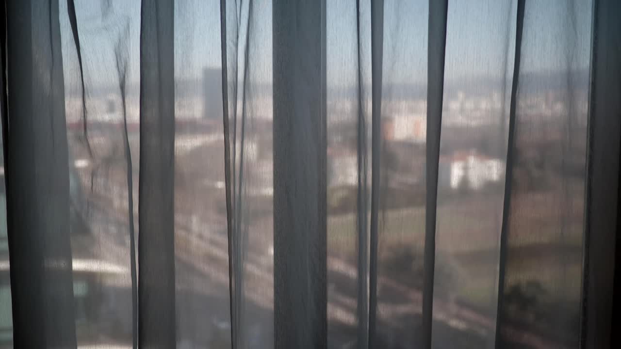 View from a window with curtains