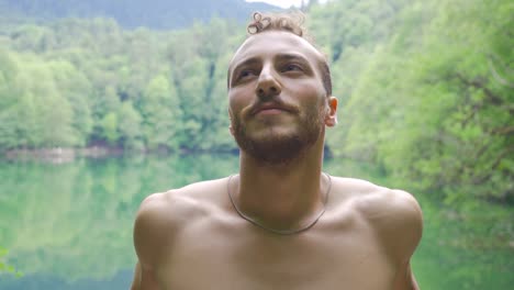 young man getting fresh air in the forest.