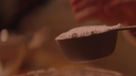 measuring flour for baking