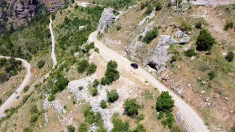 Black-Car-Driving-On-The-Road-In-Kadisha-Valley,-North-Governorate,-Lebanon