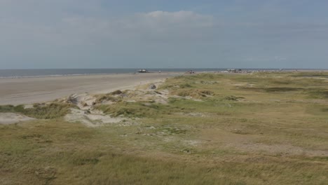 Cinematic-drone---aerial-shot-of-the-green-and-sandy-nature-beach-of-St