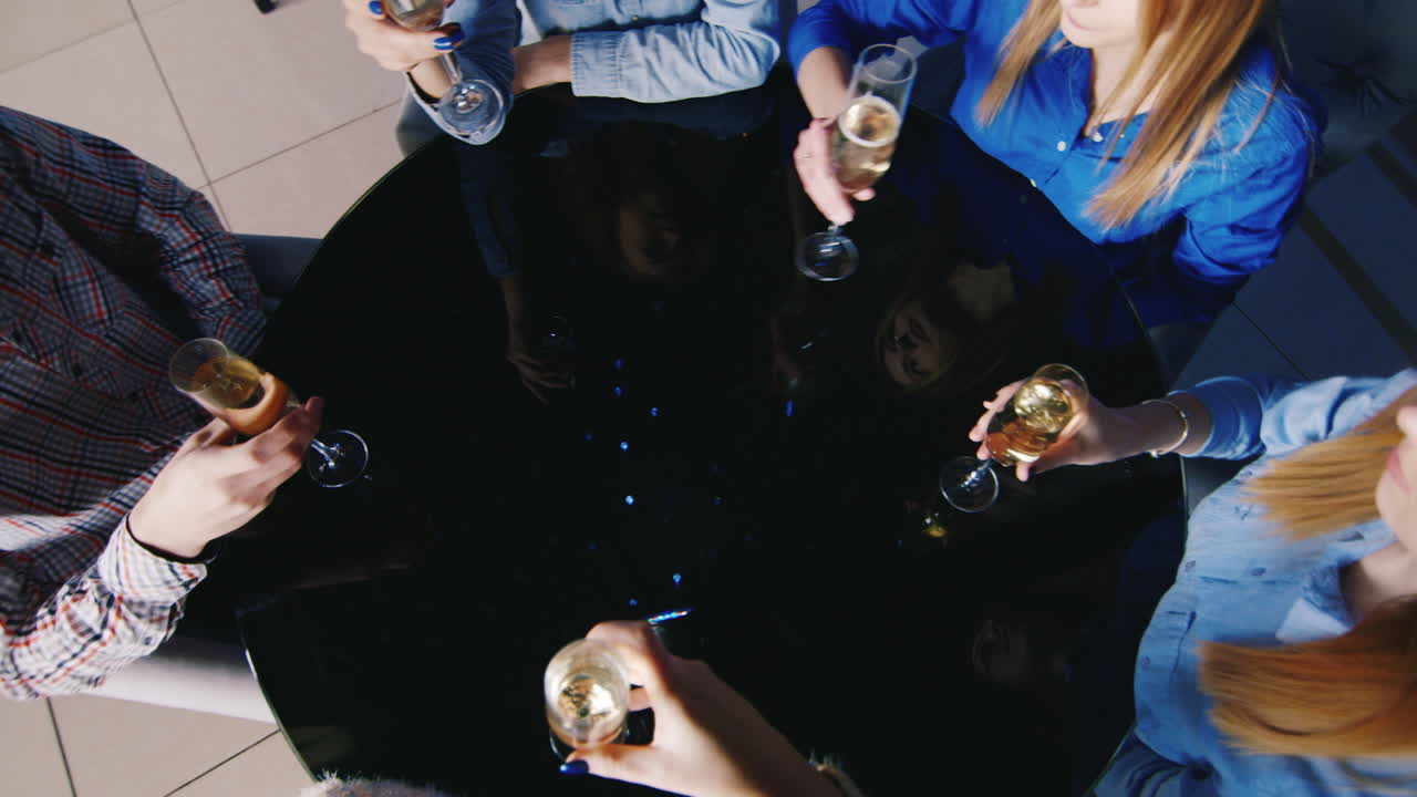 A Group Of Young People Have Fun At A Table In The Club 3