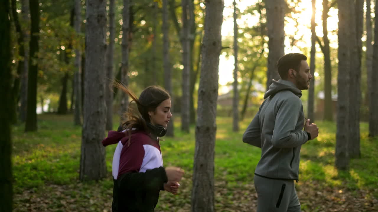 Couple running in a forest