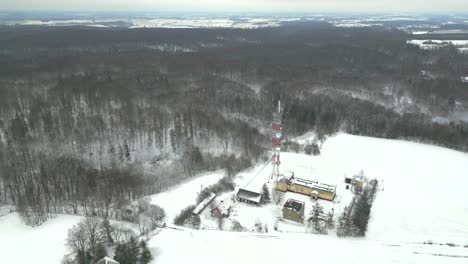 Television-antenna-amidst-a-frozen-forest-during-harsh-winter