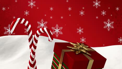 animation of falling snowflakes over christmas gift and candy canes