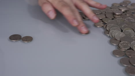 male hand counting money coins