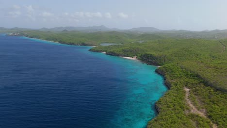 aerial view of a tropical coastline with turquoise water