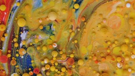 red, blue and yellow-golden bubbles on a red background.