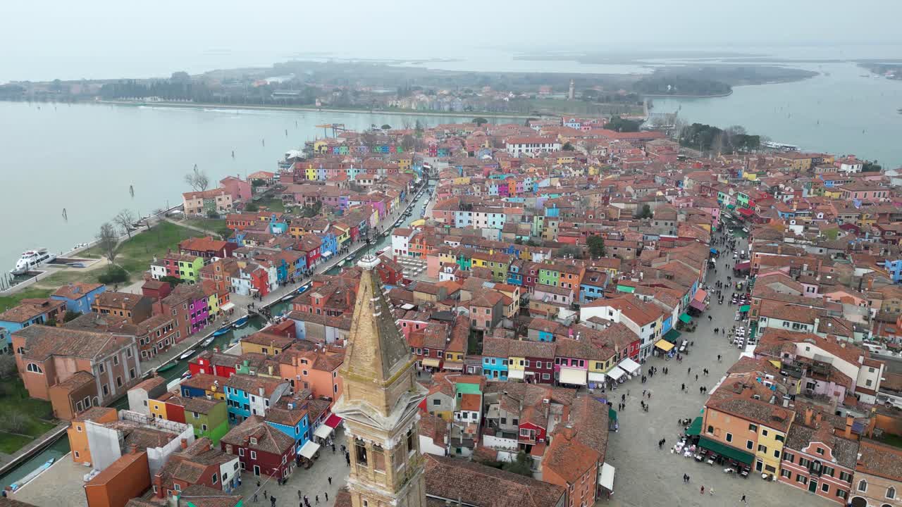 Wide Aerial of The Island Of Burano, With The Church of Saint Martin Bishop Bell Tower in Frame.