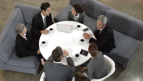 business people sitting in circle