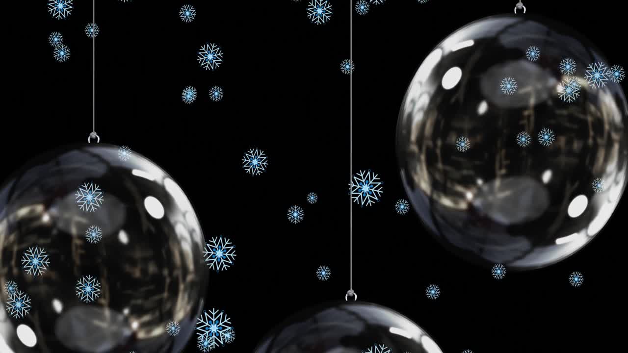 nieve cayendo sobre bolas en fondo negro