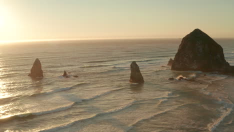 Aerial-slider-shot-of-sea-stacks-at-sunset