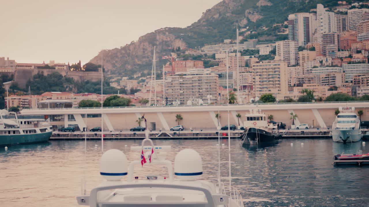 La Condamine, Monaco - November 4, 2024: View of boats docked in the Monaco Marina with the skyline of the city on the background