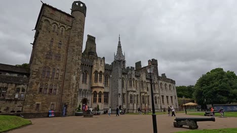 visitors explore historic cardiff castle exterior