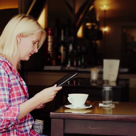 a young woman is resting in a small cafe in the city of graz