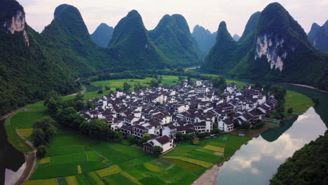 serene chinese village nestled in a karst valley