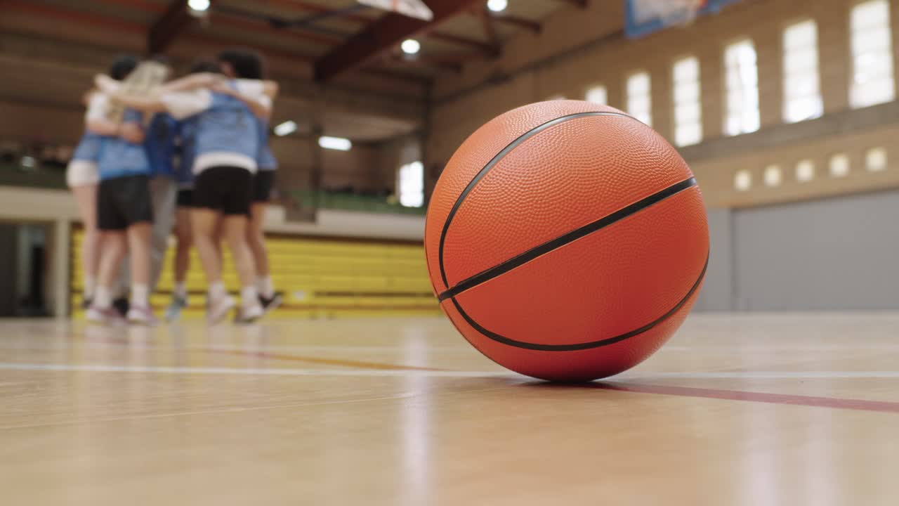 Basketball Team Huddle on Court