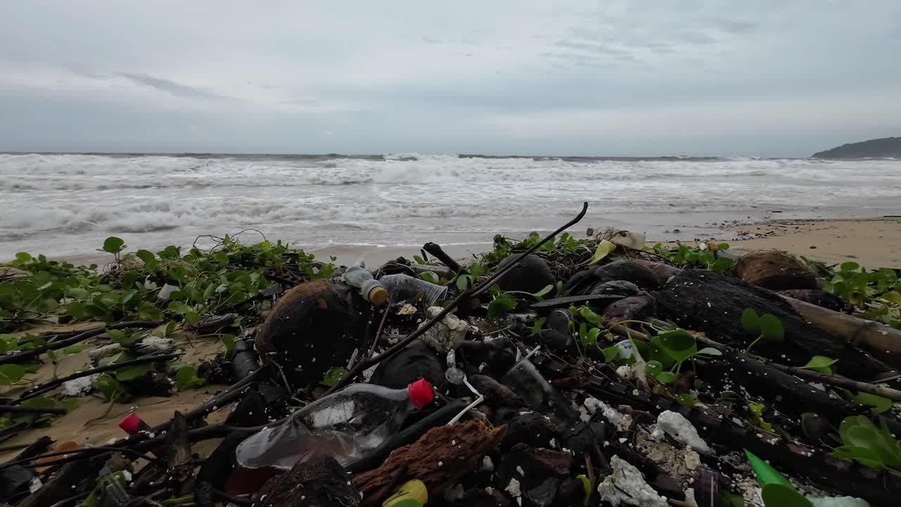 Trash at Karon Beach in Phuket Thailand.High tide brings huge amounts of Trash to the Beach during Monsoon Season