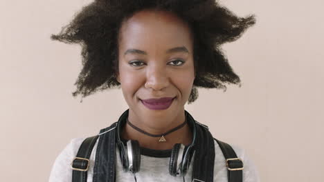 portrait of young trendy woman with afro laughing cheerful