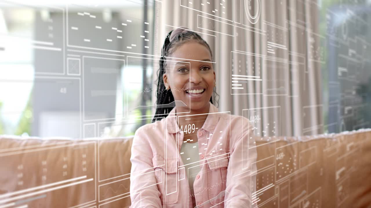Cam starting, woman sitting on couch speaking, HUD overlay aligning over face, presenting tech demo