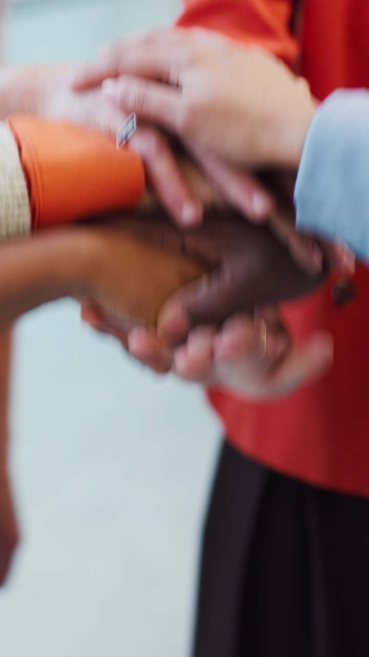 Diverse Business Team Stacking Hands in Unity for Collaboration