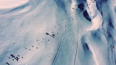 ski slopes with lift in austrian alps, aerial shot