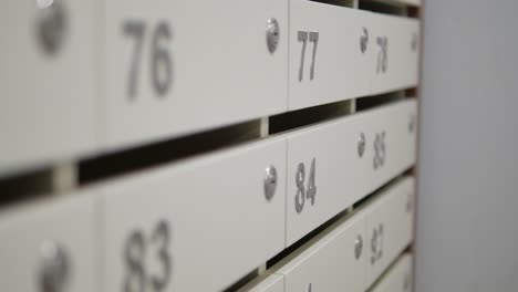 close up shot of white mailboxes with numbers