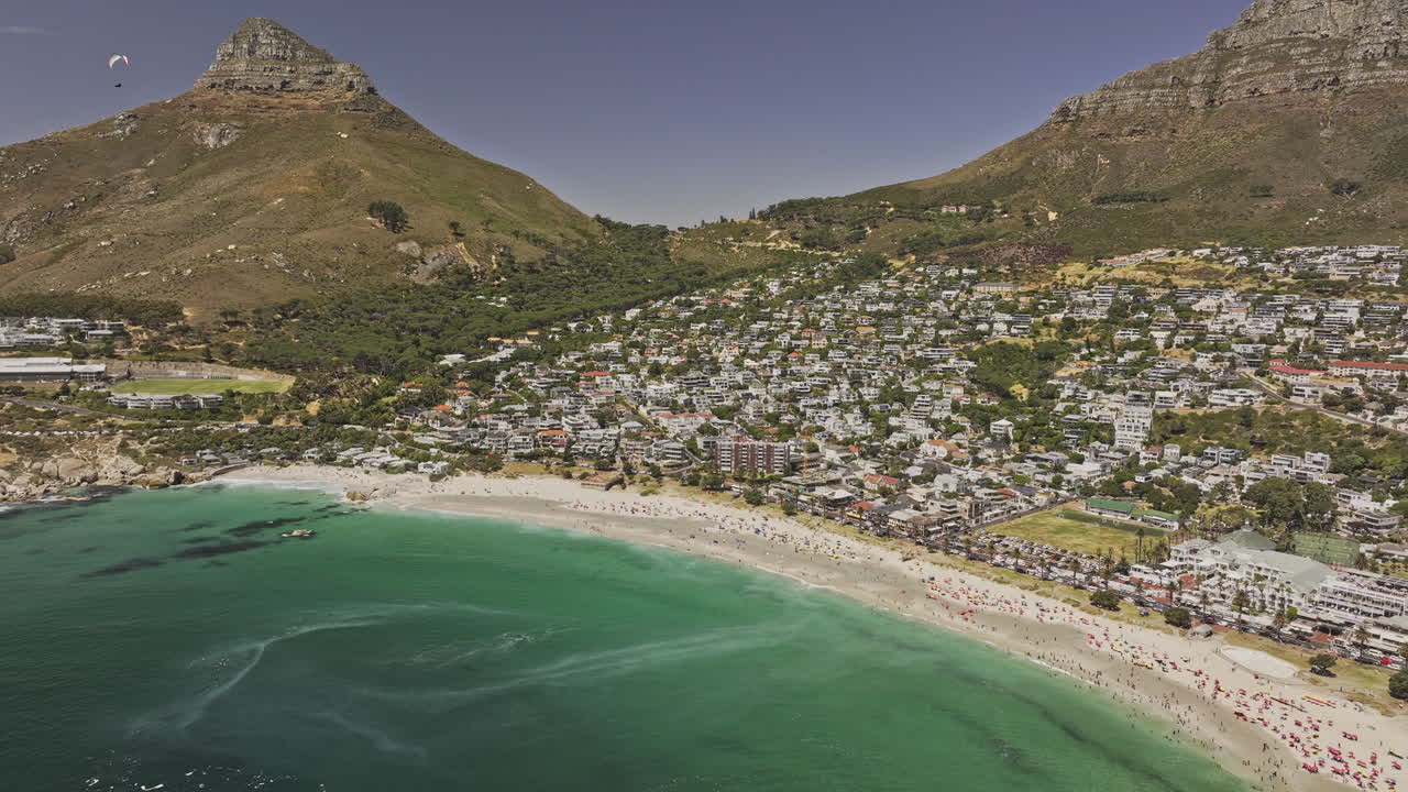 Cape Town South Africa Aerial v74 flyover Camps Bay capturing Glen beach, sandy shoreline, Lion's head, Table Mountain and Bakoven residential suburb - Shot with Mavic 3 Pro Cine - Jan 11th 2024