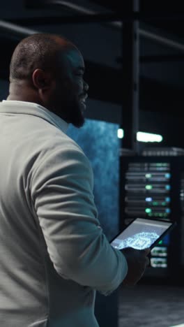 vertical video software developer in data center using tablet, employing machine learning