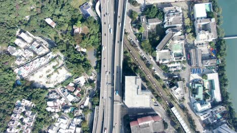 Downtown-Hong-Kong-city-skyscrapers-and-urban-traffic,-Aerial-view