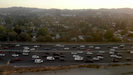 Aerial-of-busy-traffic-filled-highways-of-the-101-and-405-in-the-San-Fernando-Valley-of-Los-Angeles