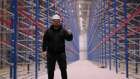 big and modern warehouse under construction, featuring metal shelving and other industrial equipment.