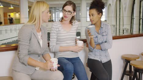 women with coffee cups