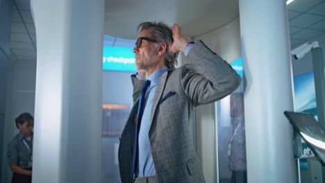 man at airport security checkpoint