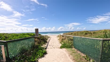 a sandy path leading to the beach