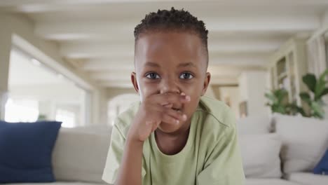 Happy-african-american-boy-making-video-call-at-home,-slow-motion