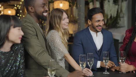 Tracking-Shot-of-Friends-Toasting-Their-Drinks-During-New-Years-Celebrations