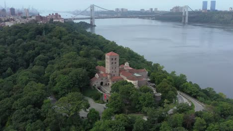 downward facing counterclockwise aerial orbit of the cloisters museum in on the bank of the hudson river in nyc