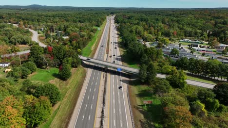 cars drive on highway in autumn fall season