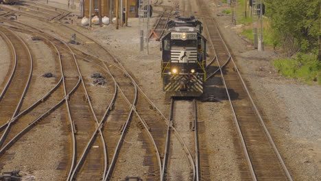 a-Railroad-train-engine-approaches-a-highway-railroad-grade-crossing-and-flashes-its-lights